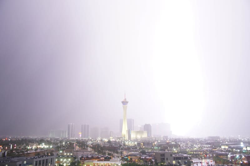 Lightning flash so bright it whites out the sky to the right of the Strat tower over the Las Vegas skyline
